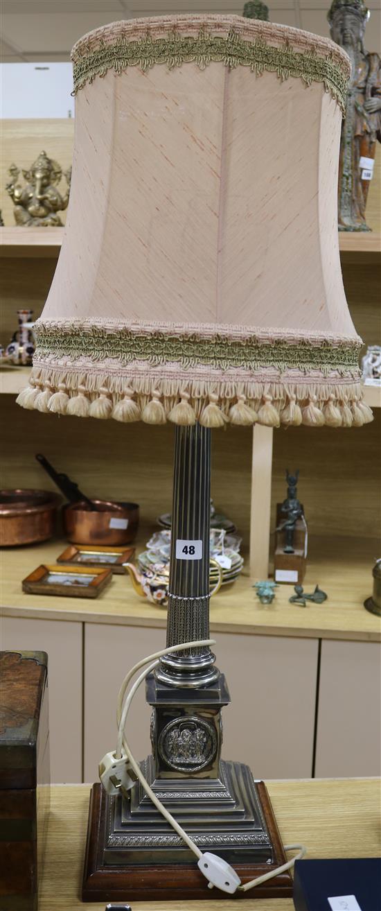An EPNS column lamp height 57cm